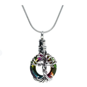 The Iridescent Cut Glass with Tree of Life Cremation pendant has the roots embracing a cut glass ring with shades of blue and green.
