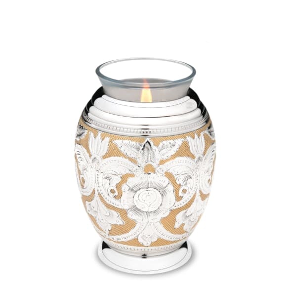 Urna de recuerdo de cremación floral adornada con candelita