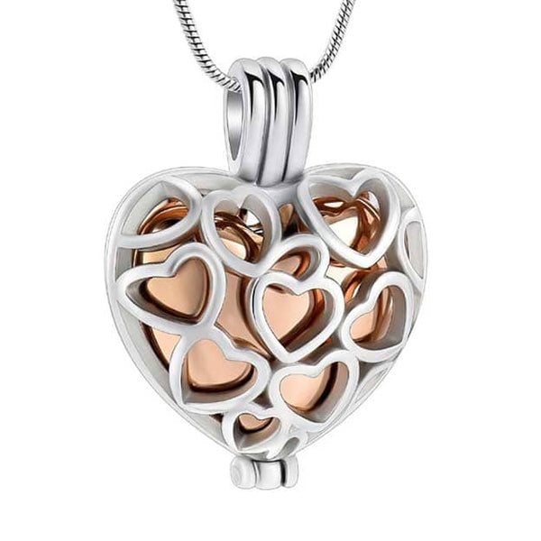 Stainless steel heart cage cremation pendant for ashes—inner heart urn pendant with screw-top closure and 22″ chain; elegant cremation jewelry necklace, memorial jewelry, and urn pendant.